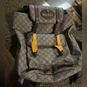 Gucci mens backpack with gold detail. In good condition